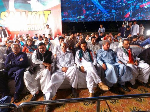 PTI Leaders sitting Sialkot Jalsa Stage Left to Right - Shafqat Mehmood, Sheikh Rasheed Ahmad, Jahangeer Khan Tareen, Imran Khan, Shah Mehmood Qureshi and Aleem Khan